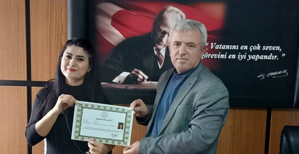 Rezan Ezer’e Bakan Özer’den başarı belgesi